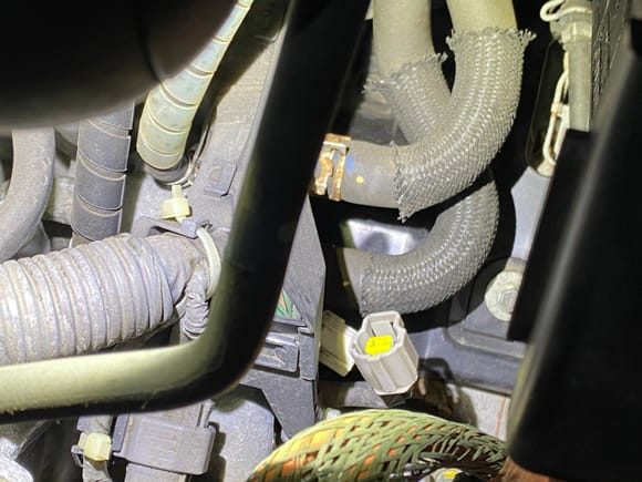 ECT connector unplugged. Located right in the middle of the V and the back of the engine next to the heater hoses. 