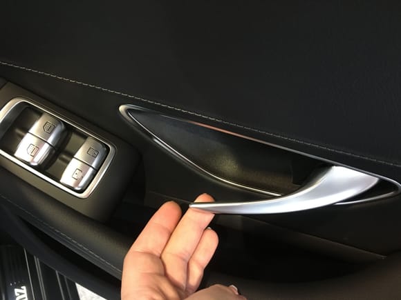 Handles didn't, didn't feel like metal to me/flexed and didn't inspire the confidence I was expecting. Door cards have a nice visual design and in the up level cars the leather is done very very nicely. 