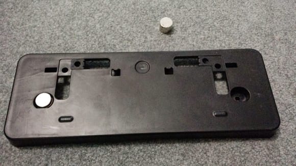 it fits perfectly into the OEM plate holder mounting holes