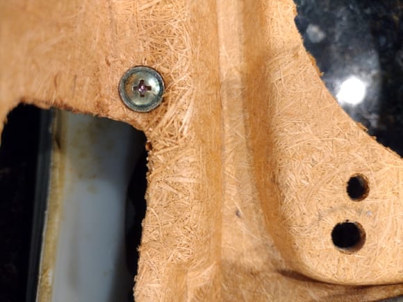 Some wood particle separation surrounding fastener head.