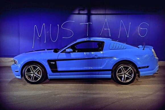 The word 'Mustang' is not photo-shopped into the picture. It was 'ghosted' which means someone has to be standing there gesturing wildly in the air to create the 'ghost'. It certainly had the desired effect.