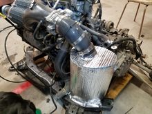 This intake gets it's air from underneath.  I also have a deflector on the bottom of the subframe to keep water away.  It has been tested in torrential downpours and did fine although I would never drive it through deep standing water.