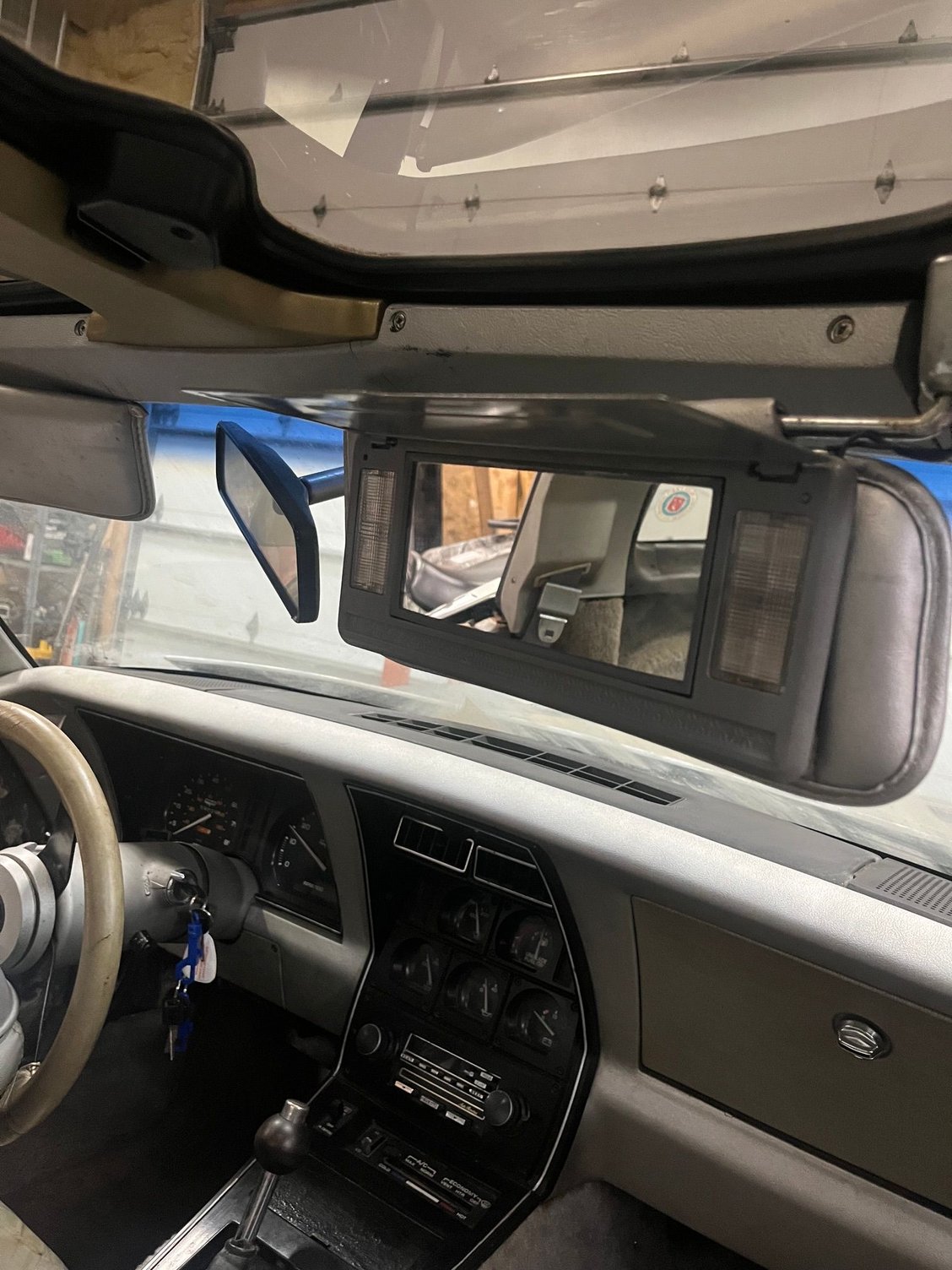 When I got it the vanity mirror was hanging.  fixed that!