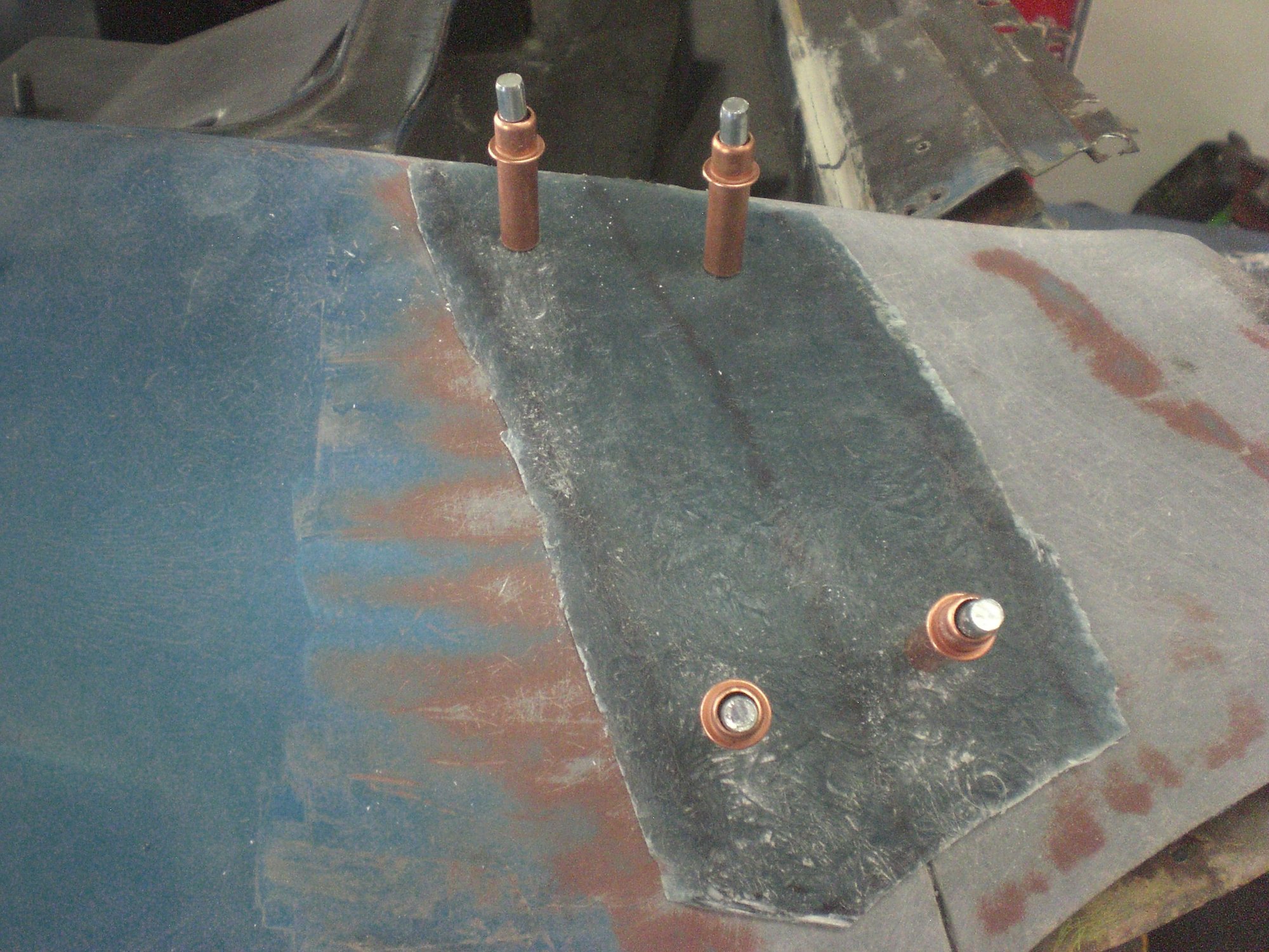 Strip shape was trimmed to fit on the underside of the fender then holes were drilled through the strip and the fender to allow placement of the cleco clips