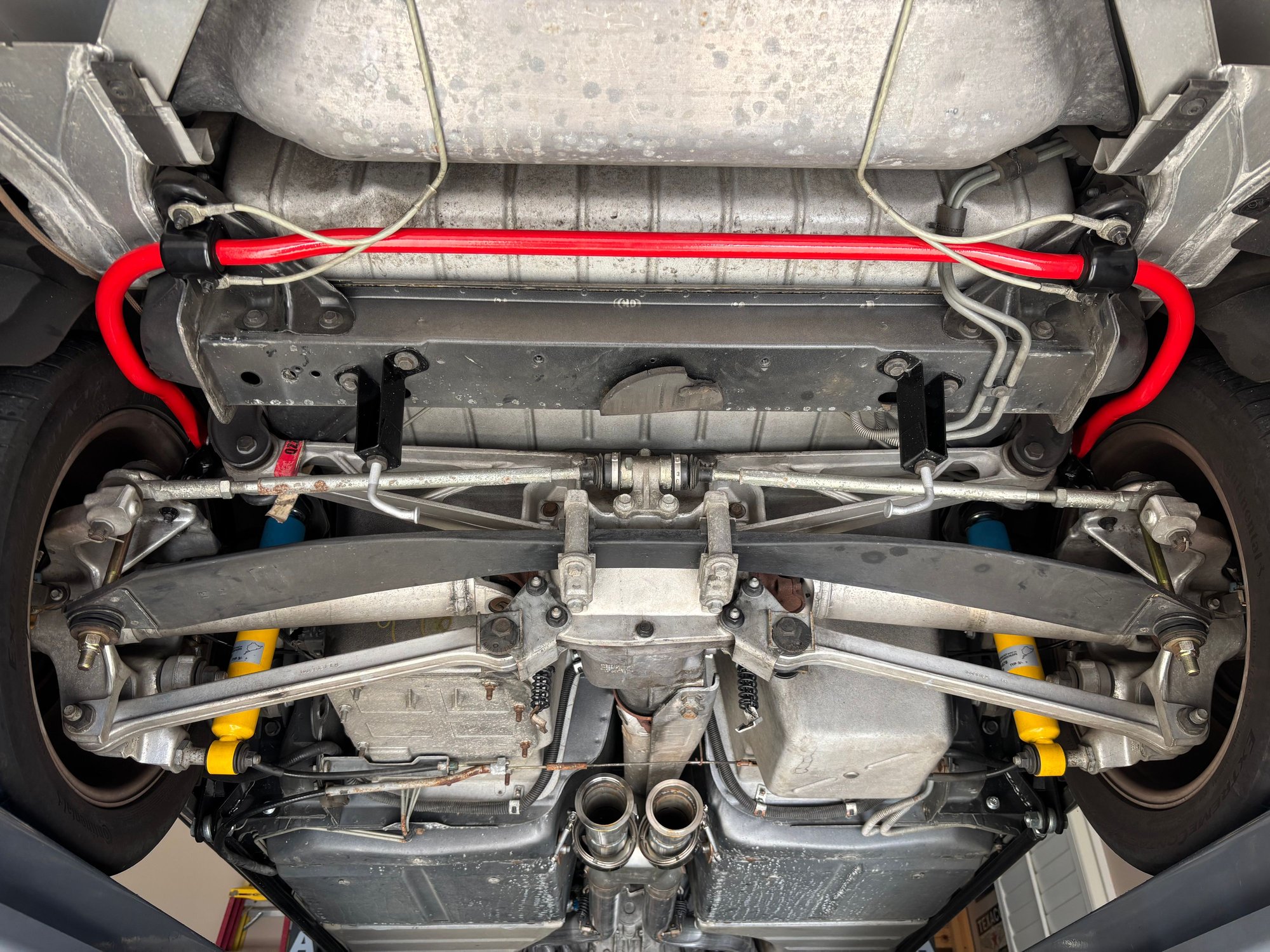 Rear view without mufflers or spare tire and carrier. 