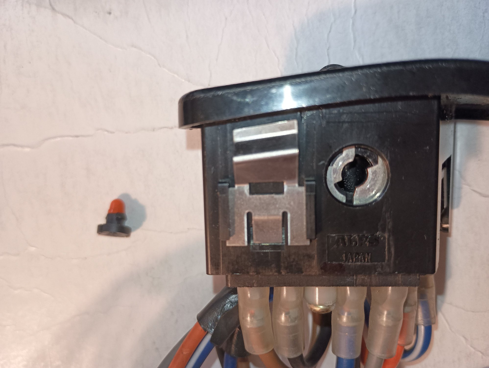 1992 Passenger Power Window Switch. Illumination socket and bulb removed.