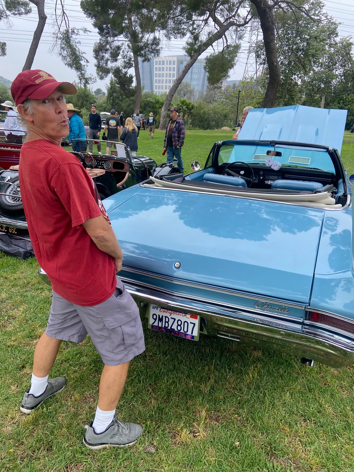 I couldn�t let the gator guy have the last word so here I am pretending to pee on HIS blue university of florida car.  (He also has an orange car.)  I sent this pic to my wife who is a >>GASP!!<< gator!  Love does crazy things!