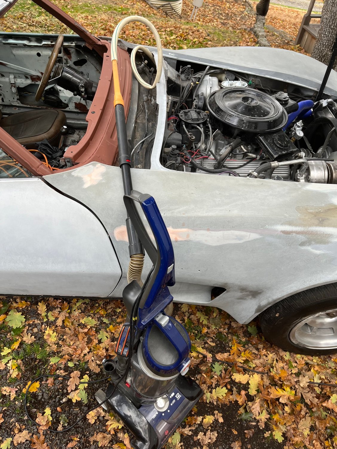 Removed both plastic screens from the wiper bay & vacuumed out the grunge inside the drain channel, followed by a thorough blasting with compressed air. I�ll eventually finish out the wiper bay, probably using truck bed liner paint.