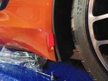 Pry out the old splash guard. (Right front)