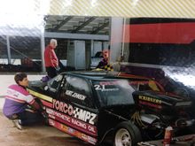 Here is a picture of me with a brand new car I had just finished building. This was at Firebird the second race of the 2000 season. We teamed up with Kurt Johnson for his rookie season. We qualified 3rd with one of Warren Johnson's engines. In the second round against Scott Geffreon we set low ET of the event, and Kurt totaled the car in the shut down area. We also won the round, but we were unfortunately done for the event.