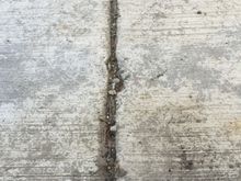 This is a joint cut in with a tool while the cement was being poured outside the shop.
These suck for rolling things
