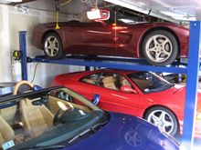 The height to the opened garage door over the top car is 8 1/2 feet.