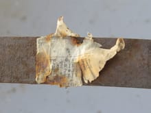 Remains of the build sheet on top right-side gas tank strap.