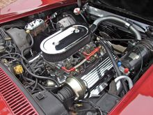 Engine bay has a lot of plumbing.
