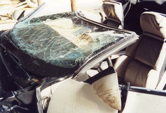 This was my 1989 convertible after it was flipped right side up.  A car thief took a turn at around 100 mph and flipped it on railroad tracks.  Got out of the car without a scratch.  Made me feel better in that respect. Lol