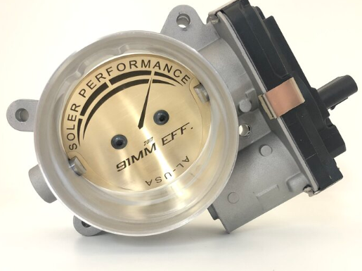 FEATURES:
•  Optimized Active Contours with sonic flow nozzles
•  Porting Taper and Upstream Bore with Velocity Stack
•  Greater Discharge Coefficient of Plate/Blade interface
•  16 Ra Microinch, Diamond Polished Surface Finish 
•  Shaftless high-pressure side of the blade for Larger WOT Flow Area (91 mm Effective Bore)
•  Self-Cleaning Throat/Flow Gap
•  Dome and Thread-locked Screws 
•  Dimpled shaft trailing edge 