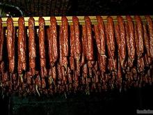 Nowicki s Landjaeger in smokehouse