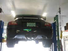 THe lift allows over 6 ' under car and misses 12' ceiling