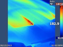 Close up of the hood vents after parking the car, note the temperature reading at the crosshairs.