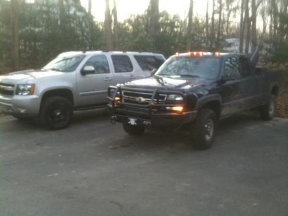 next to the wifes burb 4'' lift on 20'' ich rockstars and 33''toyo at