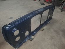 I finally got the core support to comply with the program so it went to the blasting shop and i hit it with epoxy primer and 1985 Mopar Navy Blue single stage.