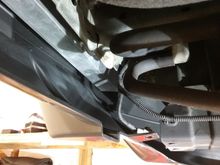 I need to build some sort of support bracket to take advantage of the factory push-pin location that holds the bottom up?  See the plastic hole?