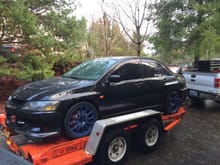 Moving the evo to the new house. Navy blue evo x wheels lookin pretty good!