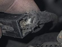 This is the starter solenoid connector/wire
Does anyone else's look like this? I don't see any wire cover under the heat sheath.
The wire itself looks a little frayed and spread out maybe even broken? I've tried to find another for comparison but can never get a glimpse under the heat sheath. 