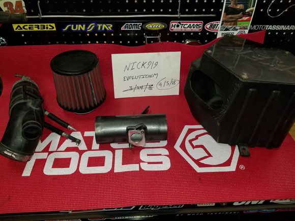AEM Intake. It's in good shape. Includes the factory intake pipe. The filter has a small wear spot on it, shown in the picture below. Also, the cover on the intake box has a stripped screw and it cannot be removed, but the cover itself can still be removed with the screw still in place. 

Im asking $150 plus shipping. 