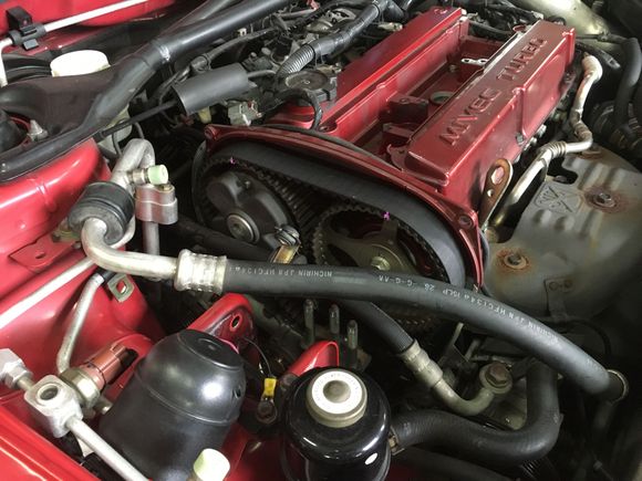 The original, 20-something thousand mile belt. It looks pretty good. You can also see the paint markings to help spot TDC easier.