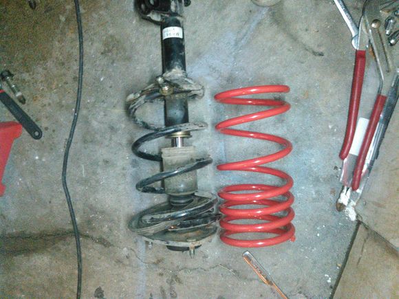 the cut spring compared to the new lowering one. Oh how fun these were to get out with out any power tools. But, in the future, i got a trick:)