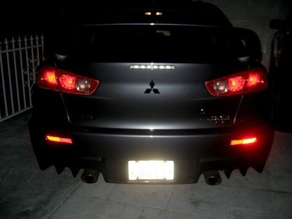 Night lights with camera flash - gorgeous set of aggressive tail lights and reflectors. Angry trunk mouth that finishes off the rear angry face <3