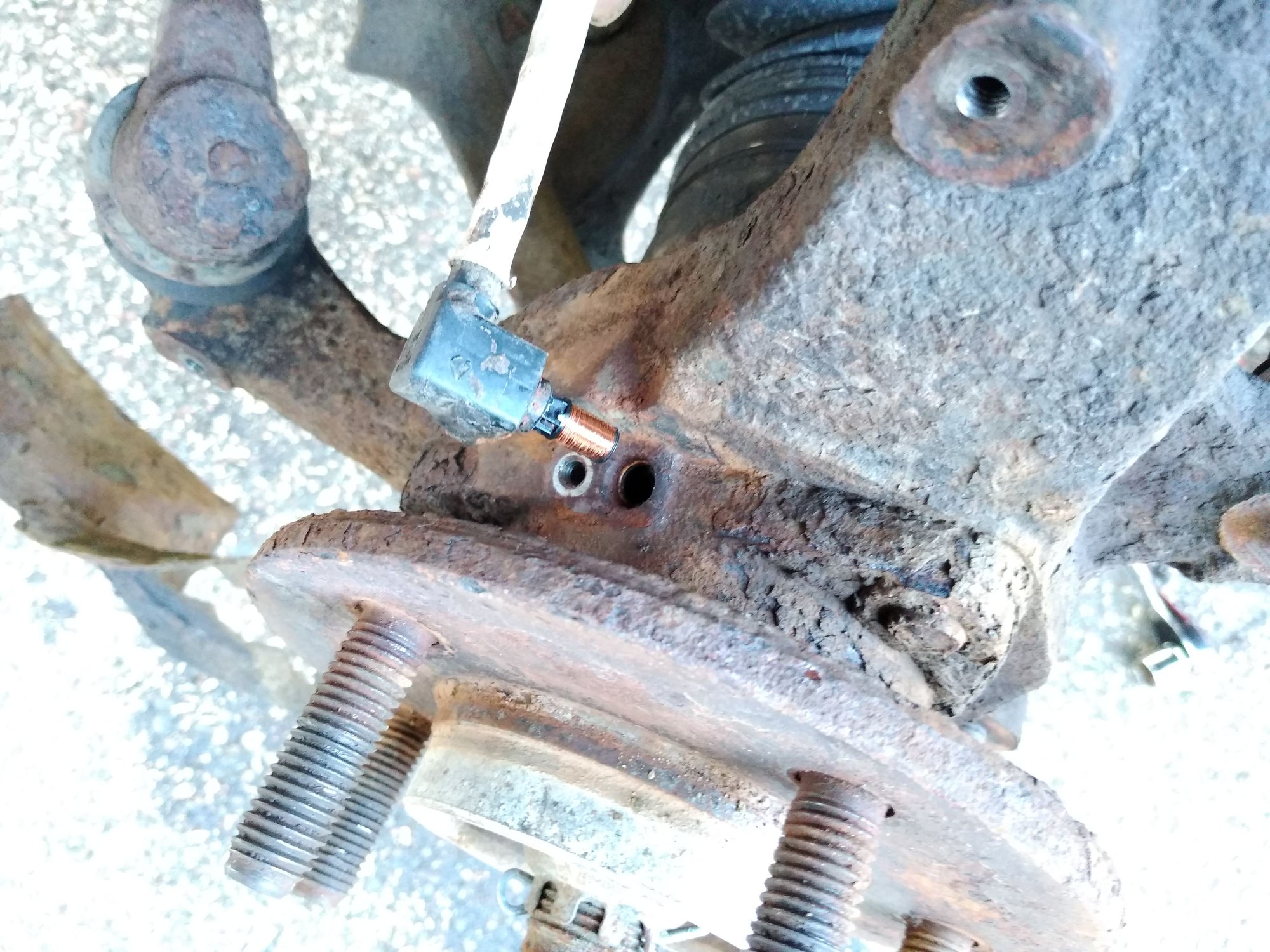 Extraction tool and process to remove stuck plastic ABS sensor behind