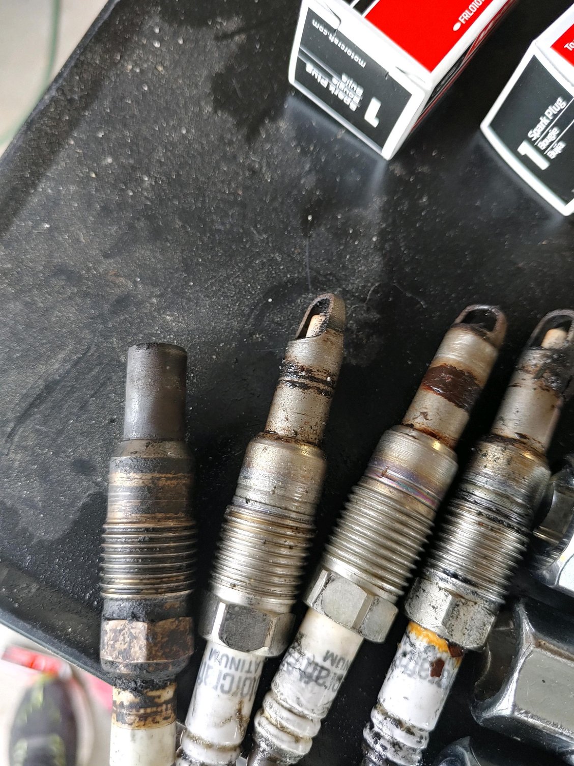 Spark plug came out with entire tip missing, where did it go? Ford
