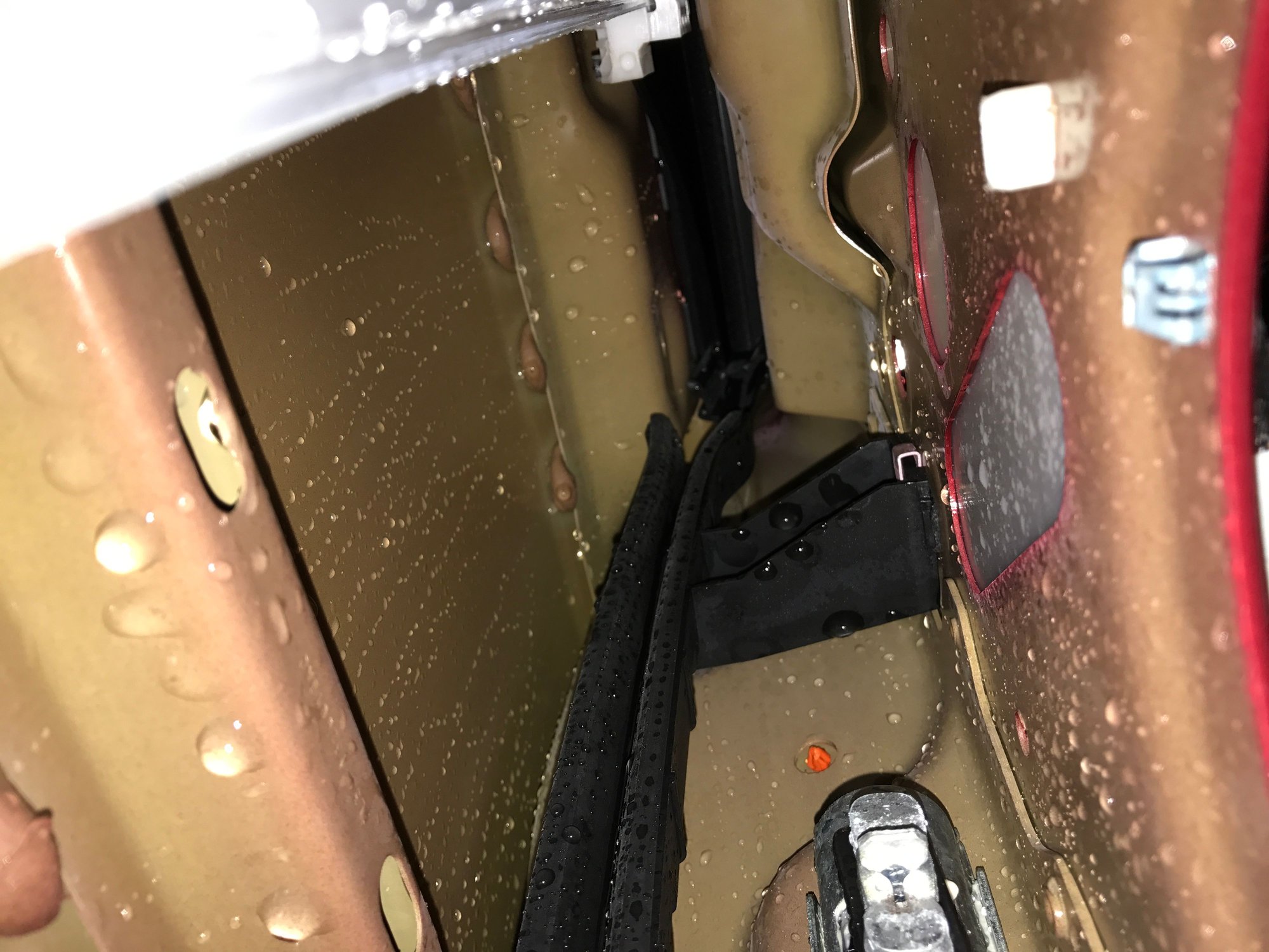 Has anyone ever solved the water leaking through the doors issue