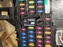 this is the panel under passanger seat , im not sure what fuse it is , manual says its under the hood not under the passnager seat  but i couldnbe wrong 