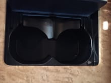 These are the 2-stage cup holders in my infinity QX80. Sweet for small things and see pic below, have a flap that swings open for larger cups, best of both worlds IMO. My f-150 has a ton of cup holders but a couple wider ones would be nice