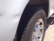 Small ding behind passenger side rear tire