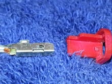 using a very small screwdriver you can "lift" the plastic tab lock inside the connector to PULL wire out bottom of housing.