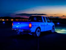 The taxiway lighting of my airport makes my white truck look blue!