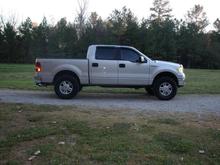 06 screw 4x4 straights with 5" tips,2.5" hell bent steel leveling kit installed,17" stock rims and 35" mud grapplers, 22s are gone!!!!!!!!!