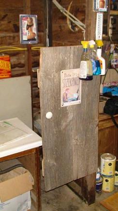 front door, made from old barn wood at about 3:30A.M.
The sign is from Germany. It says "please sit while you pee"