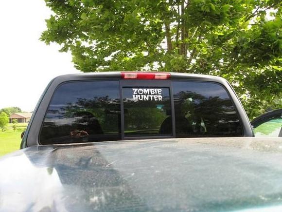 It says Zombie Hunter. Not the best due to shaky hands, but its good enough.