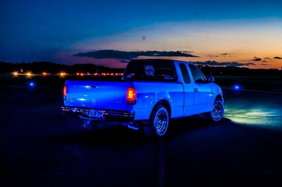 The taxiway lighting of my airport makes my white truck look blue!