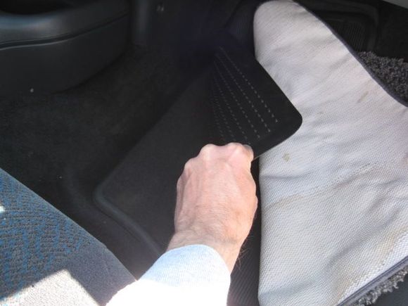 My aunt was apparently a girl after my own heart -- scraps of carpet, over rubber floor mats, over factory floor mats.....lol