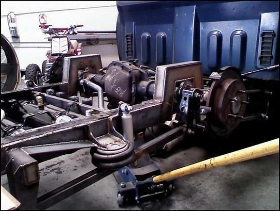 lifting the axle on the jack. this is how the frame looks to lay on the ground. the axle in the c- notch and no air in the back.