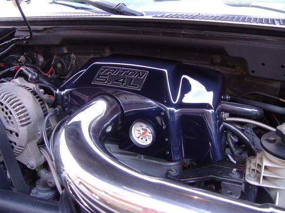 Throttle body cover.. I made a place to mount the extra fuel gauge I had. sanded it down smooth, painted, cleared, wet sanded and hand polished....looks better in person