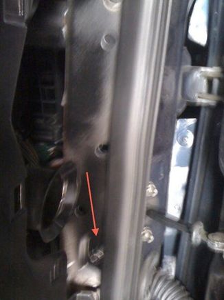 the bottom gold screw on the passenger side