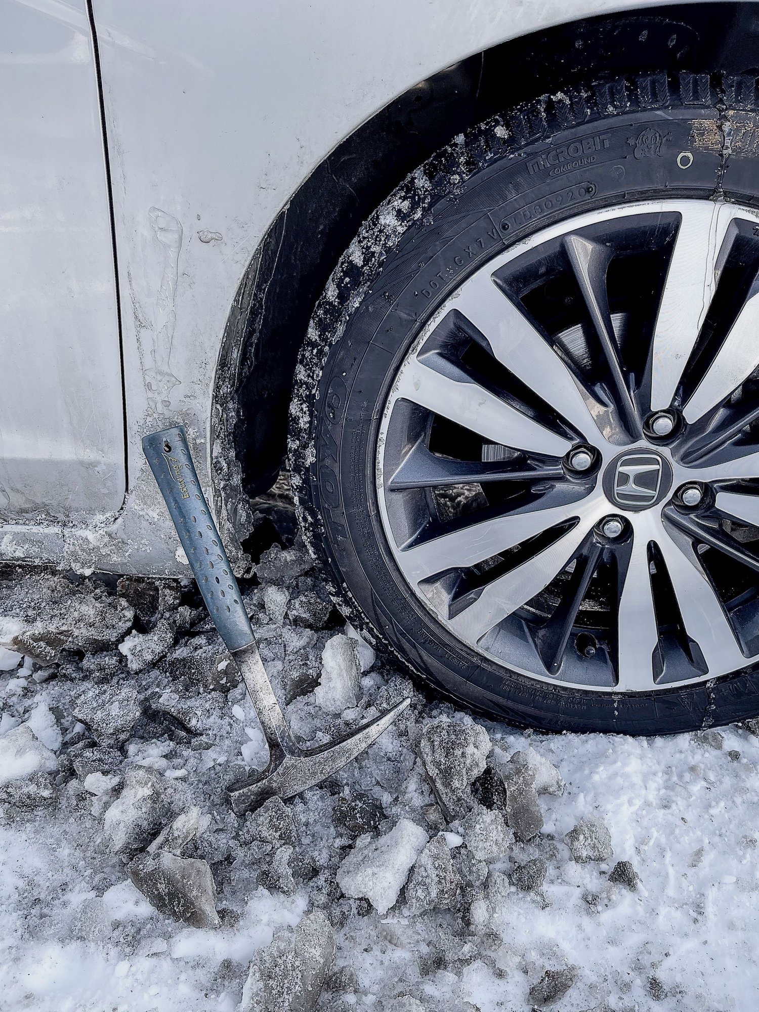 Geologist hammer works best for the wheel wells.