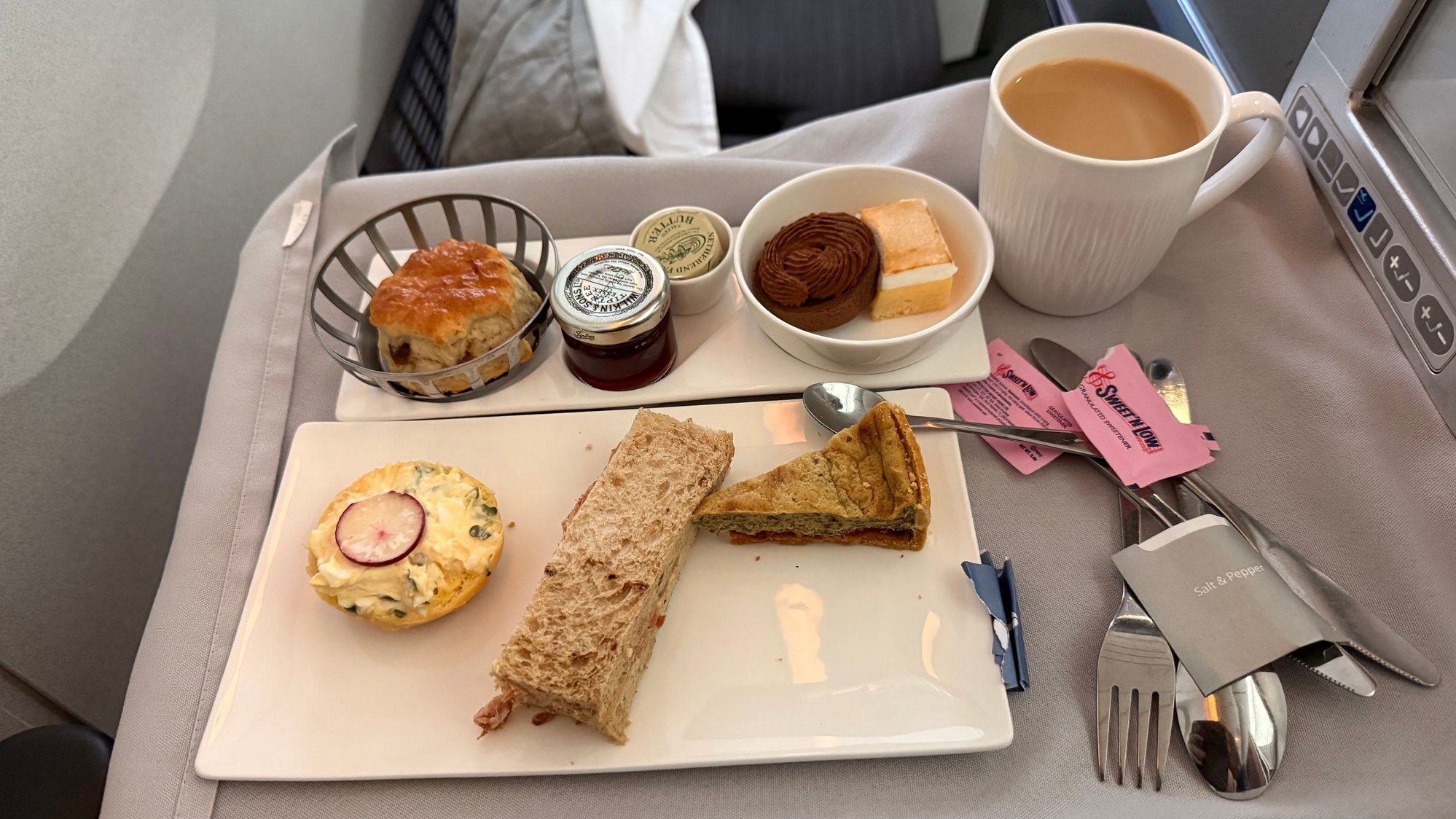 Sandwiches average at best, no clotted cream for the semi-warm scones